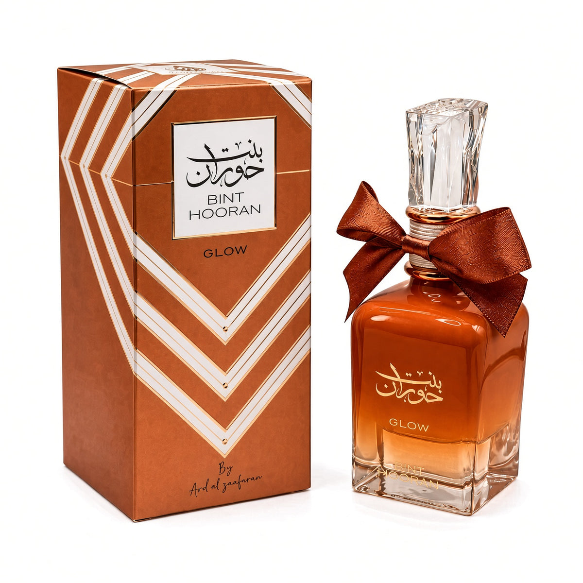 Bint Hooran Glow by Ard al Zaafaran Eau de Parfum 100ml – amber bottle with copper bow beside its copper-brown striped gift box